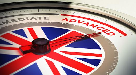 Dial with english flag with needle pointing the word advanced. concept image for illustration of english courses levels
